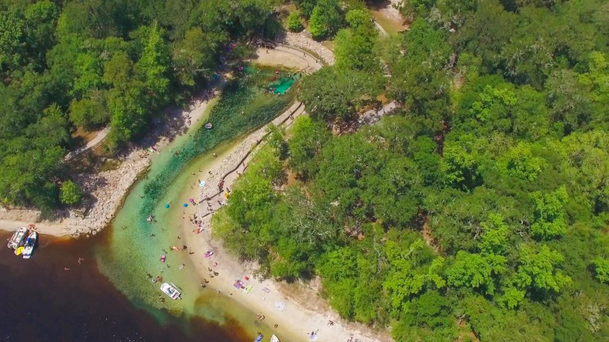 aerial view of boaters and swimmers in the Suwannee River