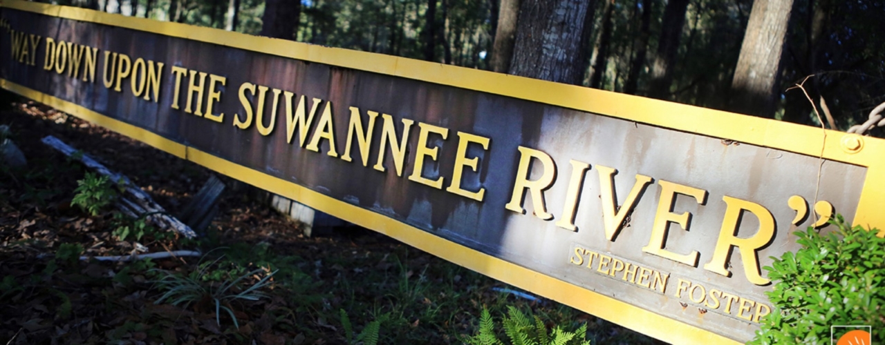 A sign with the words Way Down Upon the Suwannee River